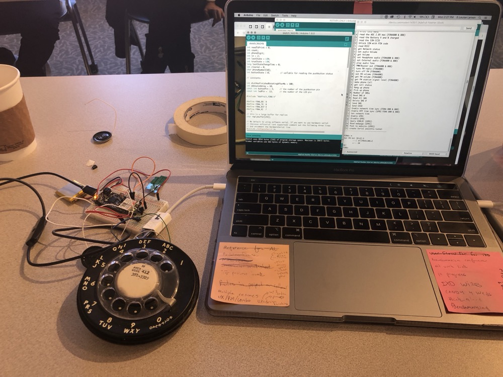 A rotary phone wired to an Arduino and a laptop.